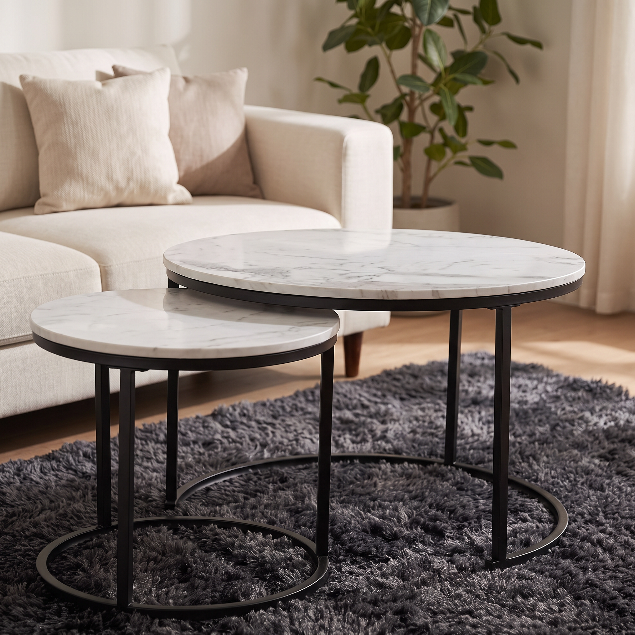 Marlowe nesting tables nested beside a linen sofa