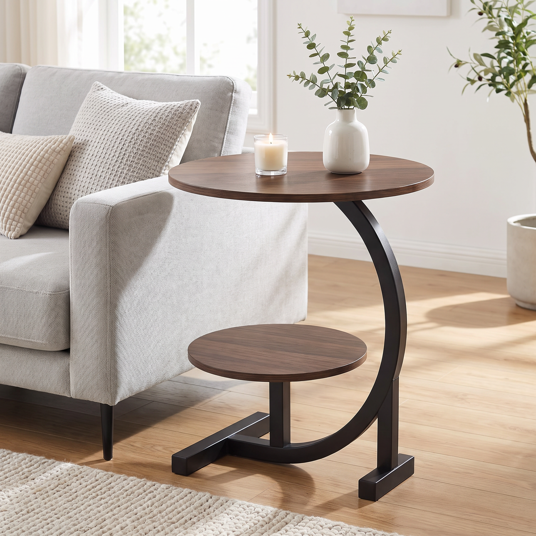 Elira accent table beside a sofa with a vase and candle