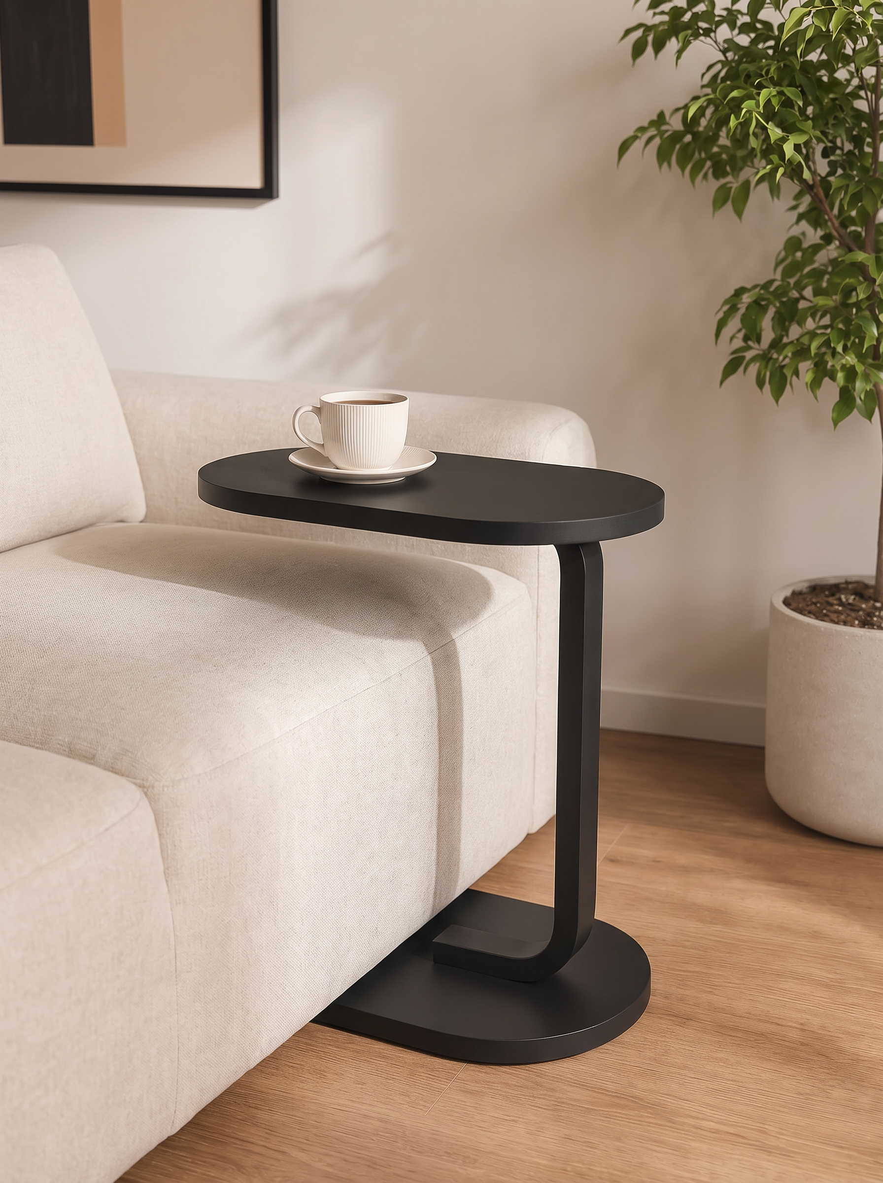 Aldon table reaching over a sofa seat with a coffee cup