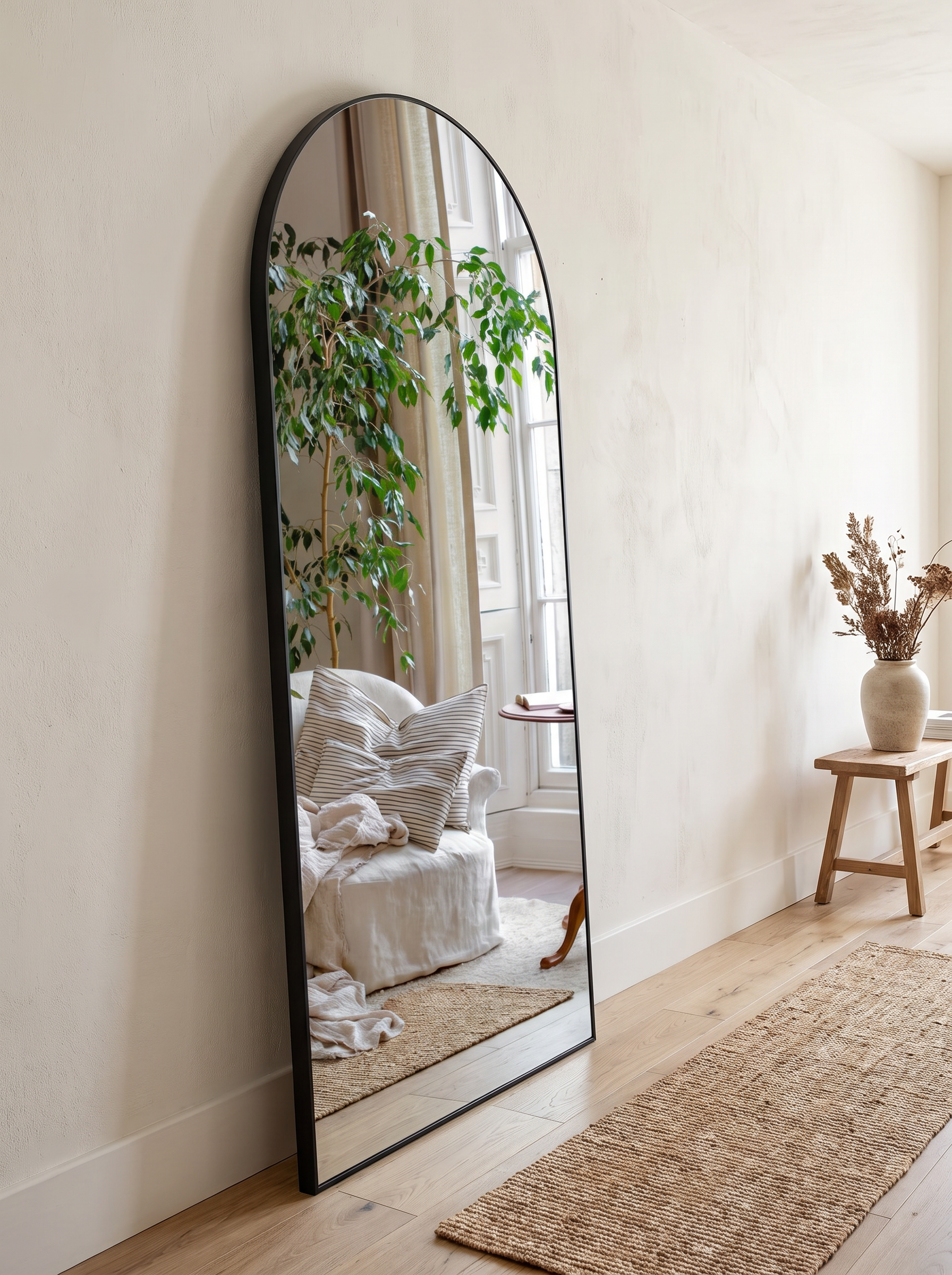 Aurella mirror leaning against a hallway wall